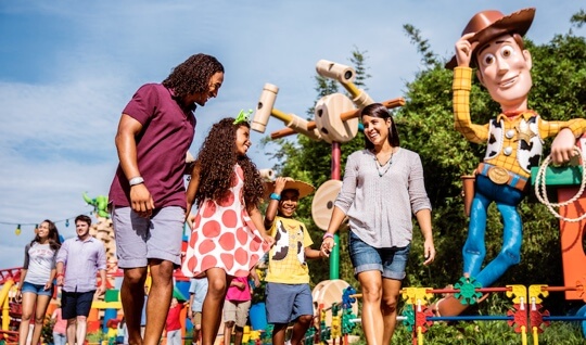 Family of four enjoys Toy Story Land at Walt Disney World.
